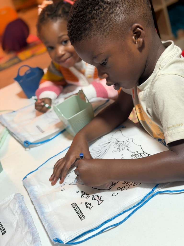 Children playing in colorful play area at Graceland Kids Center